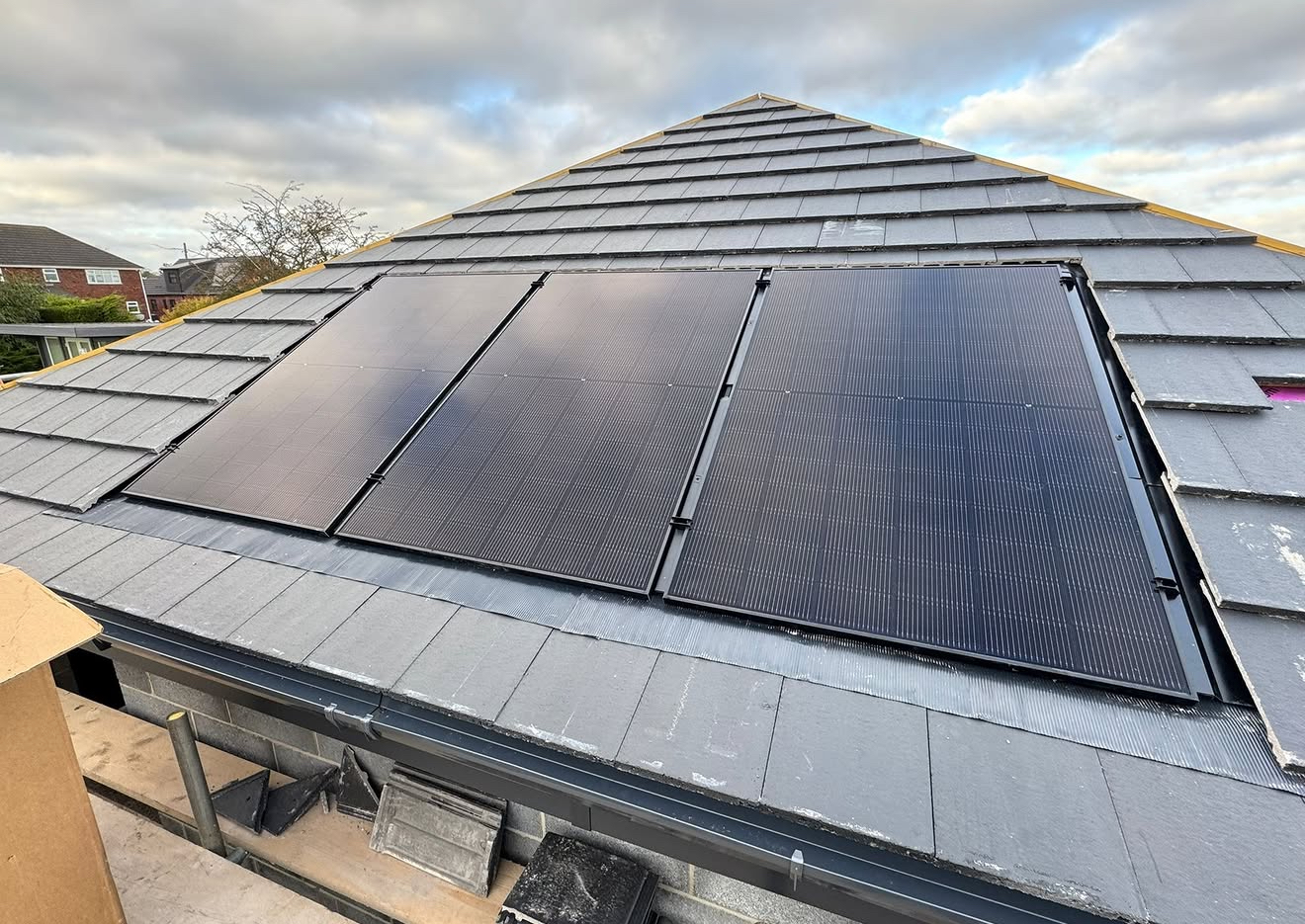 Hip roof with three solar panels installed