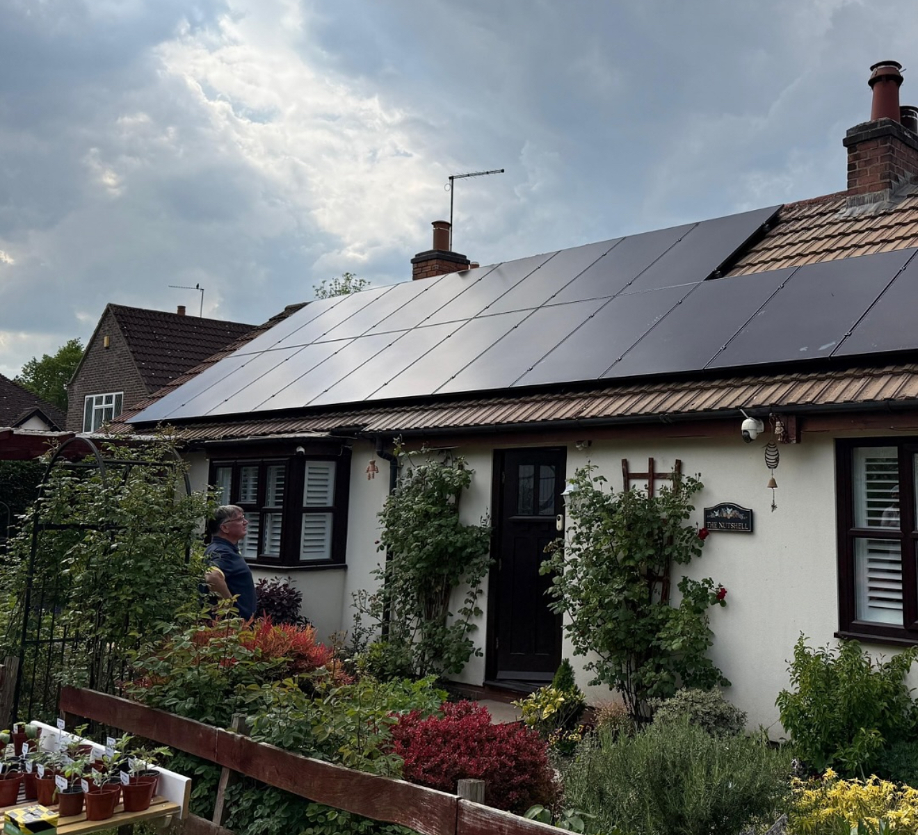 Bungalow roof fully covered with black solar panels