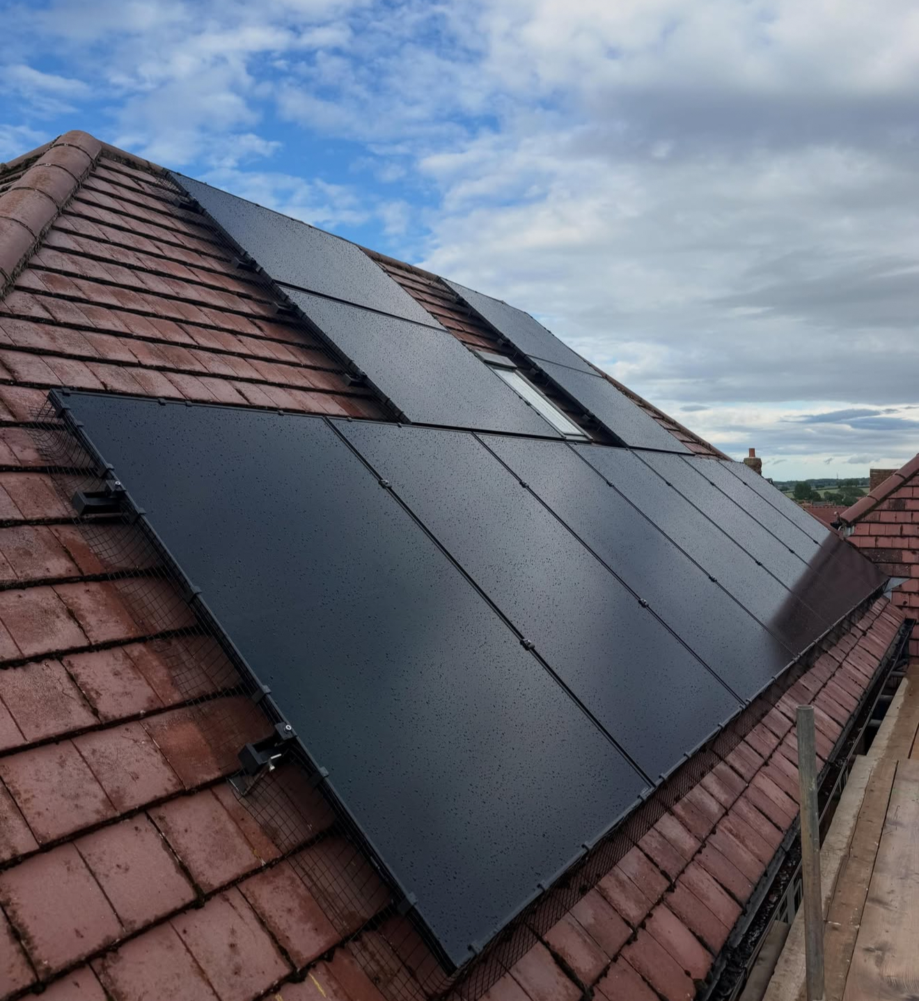 Solar panels on a terracotta tiled roof